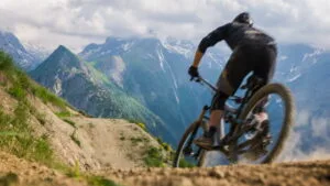 A man is mountain biking-essay writing