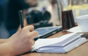 boy is writing- Novel Writing
